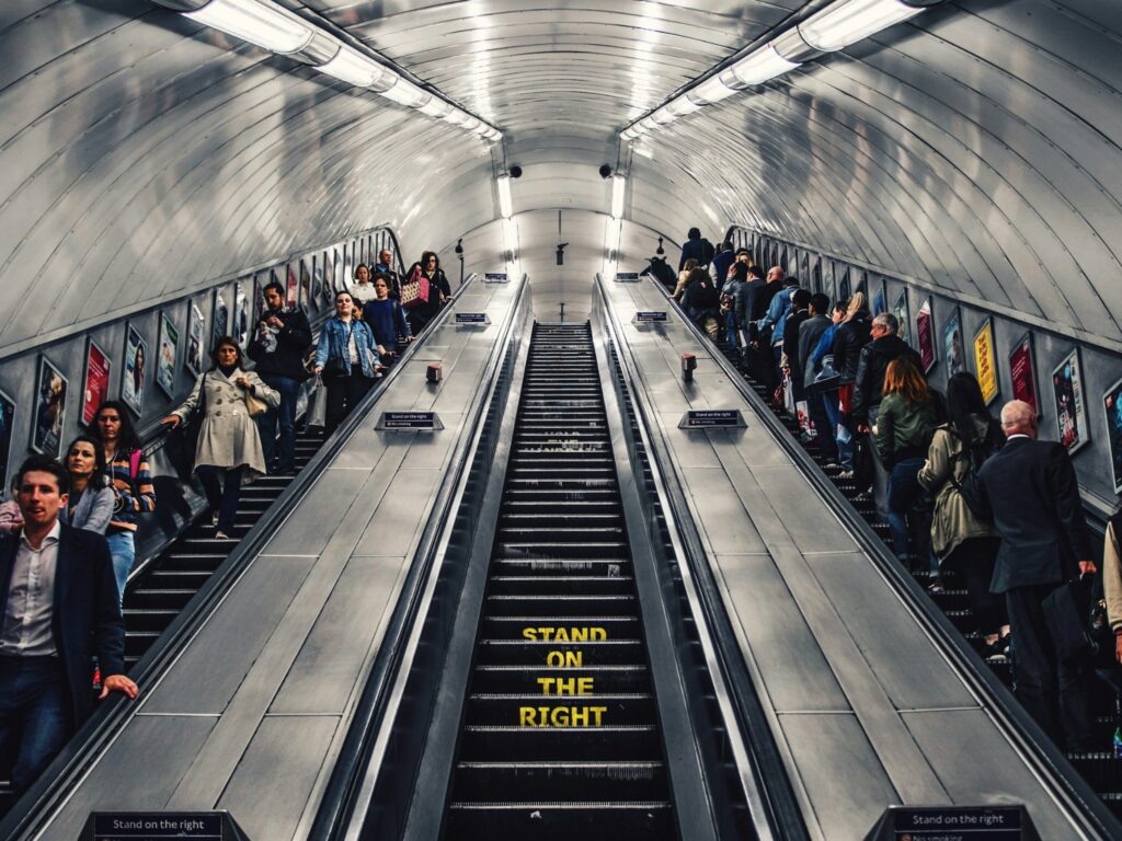 People on London Underground escalato